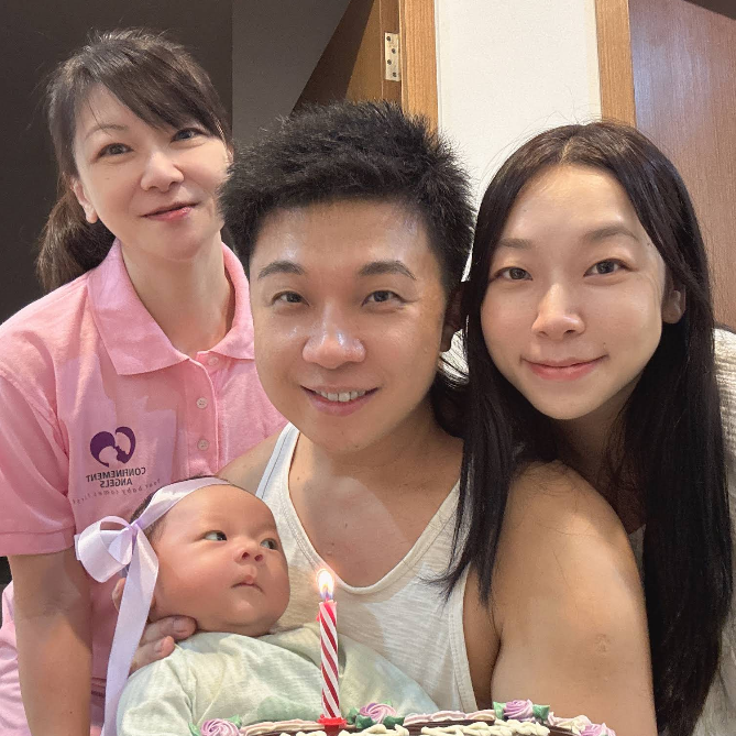 group photo of Singapore parents smiling together with their Confinement Angels nanny, showing trust, warmth, and family bonding.